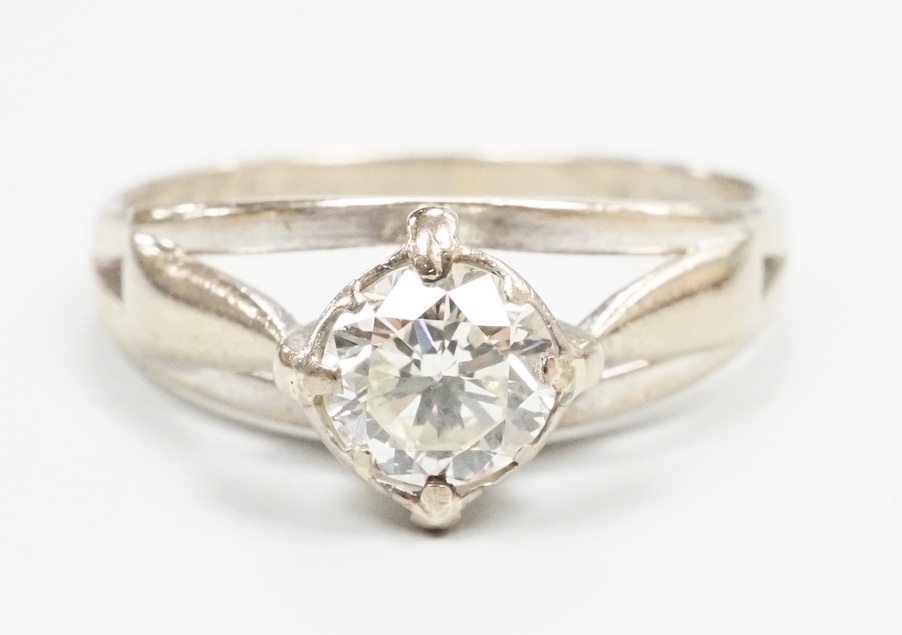 A modern 18ct white gold and solitaire diamond ring, size N, gross weight 3.7 grams.